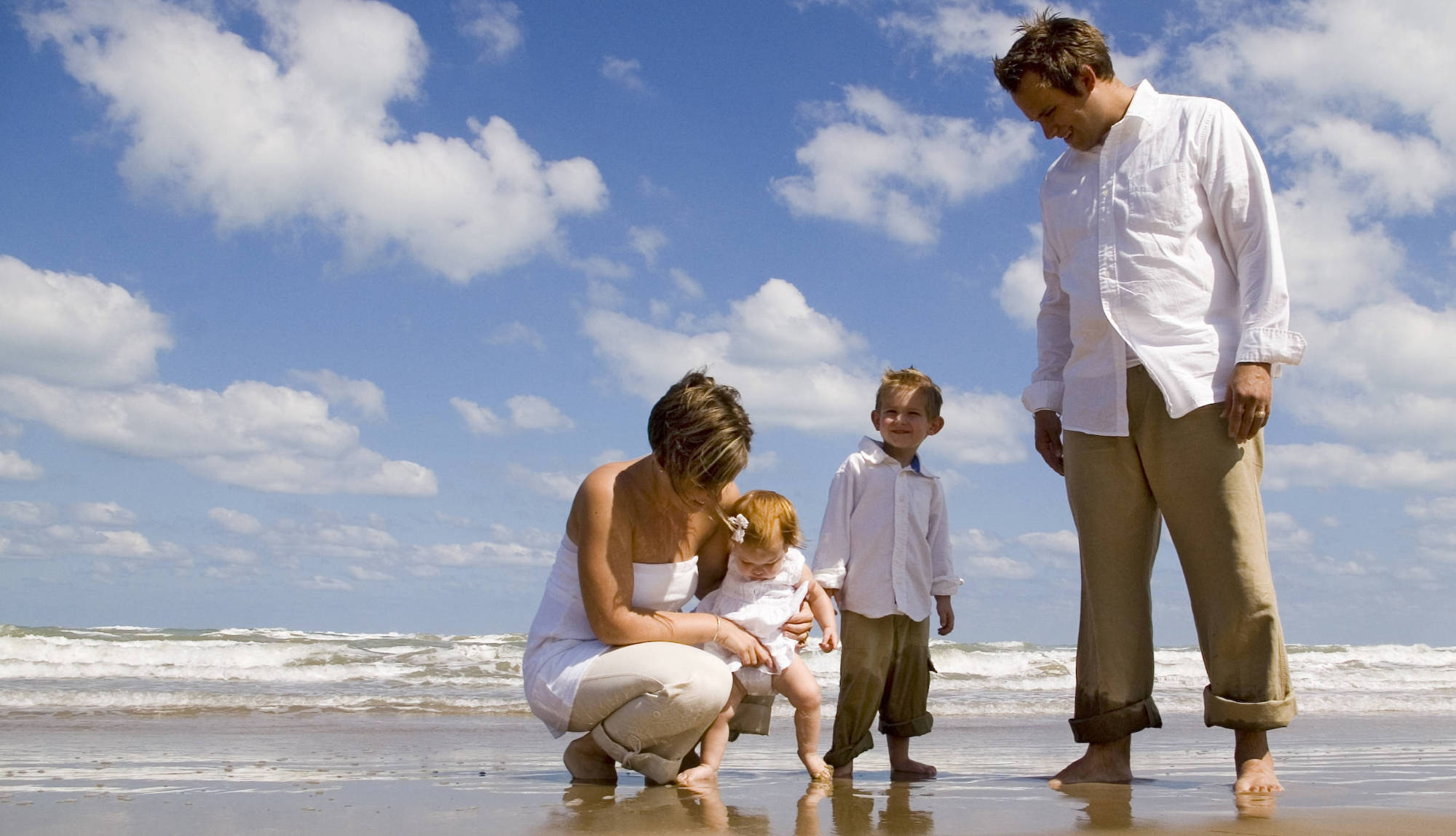 Employees and their family visiting the beach